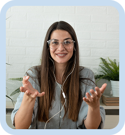 Smiling woman with glasses and earphones speaking during an online video call